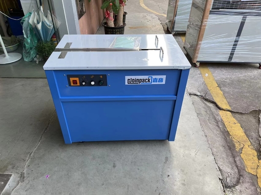 自動ドライブを半詰める機械を紐で縛るPPベルト手のバンディングのカートン箱